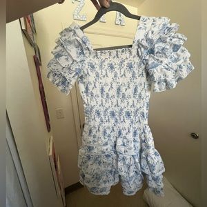 White and blue floral mini dress. Only worn once! Willing to negotiate price.